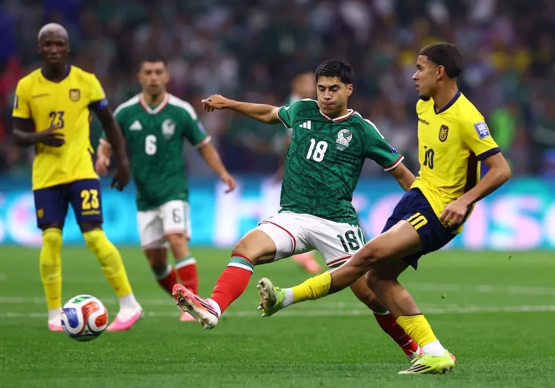 Mexico and Ecuador players contesting for the ball Mexico and Ecuador players contesting for the ball