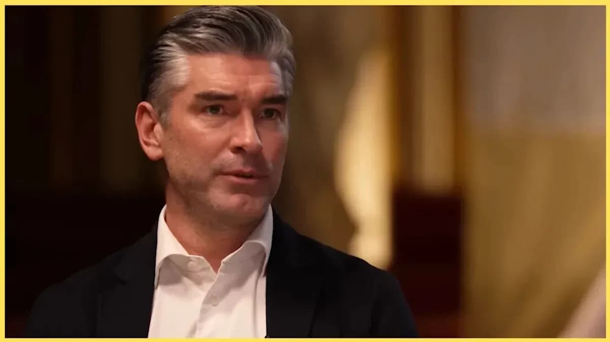 Man speaking in a formal interview setting Man speaking in a formal interview setting