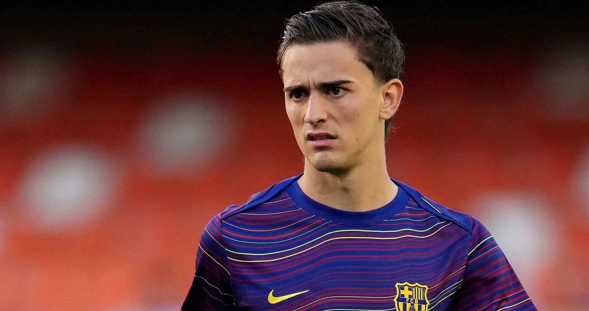 Player wearing FC Barcelona training jersey on field Player wearing FC Barcelona training jersey on field