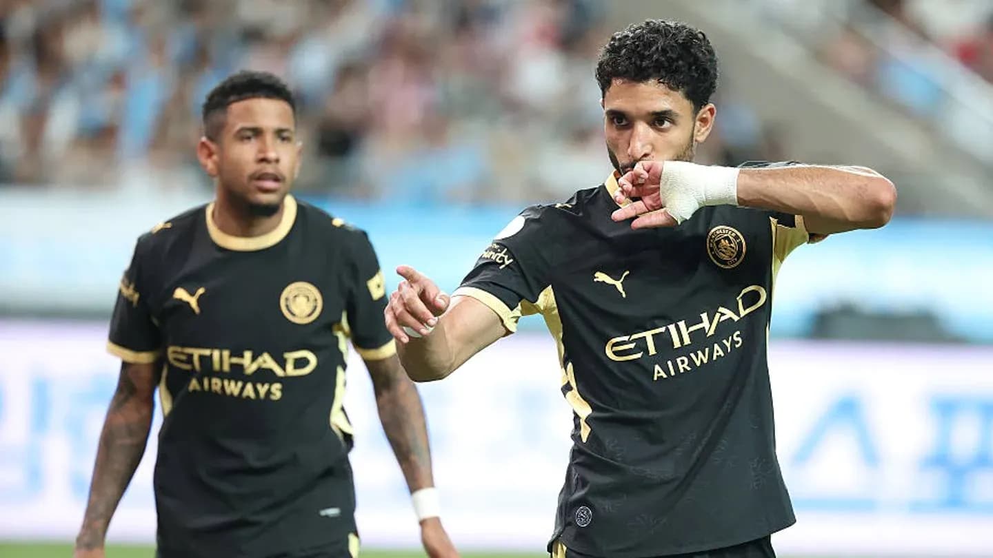 Player celebrating a goal during match with teammate Player celebrating a goal during match with teammate