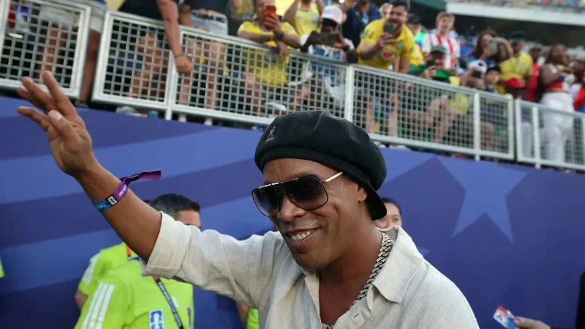 Man waving to fans at a sports event Man waving to fans at a sports event