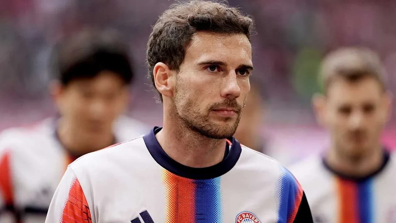 Player walking onto the pitch in team jersey Player walking onto the pitch in team jersey