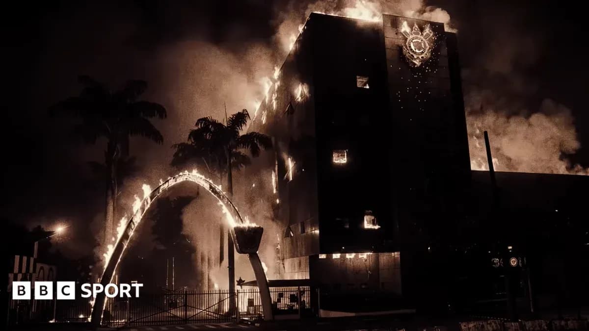 Building engulfed in flames with smoke rising Building engulfed in flames with smoke rising