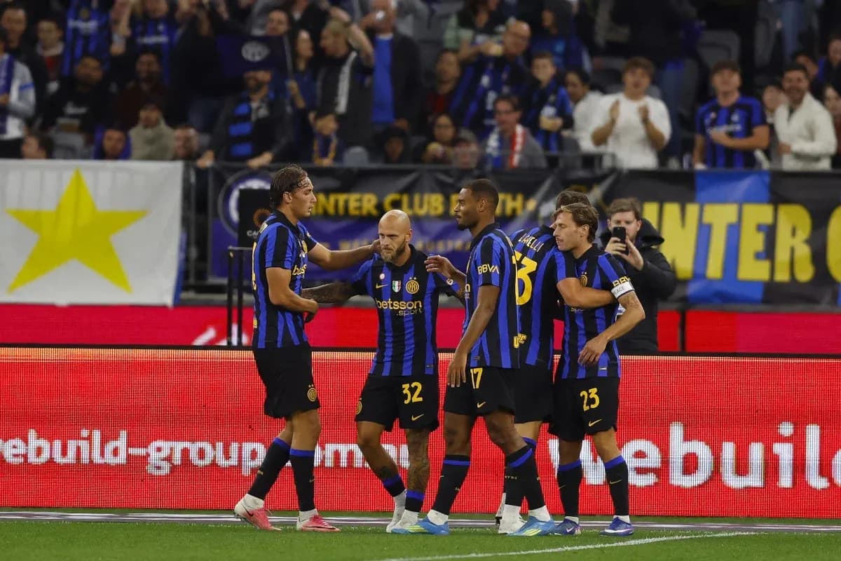 Inter Milan players celebrating a goal on the field Inter Milan players celebrating a goal on the field