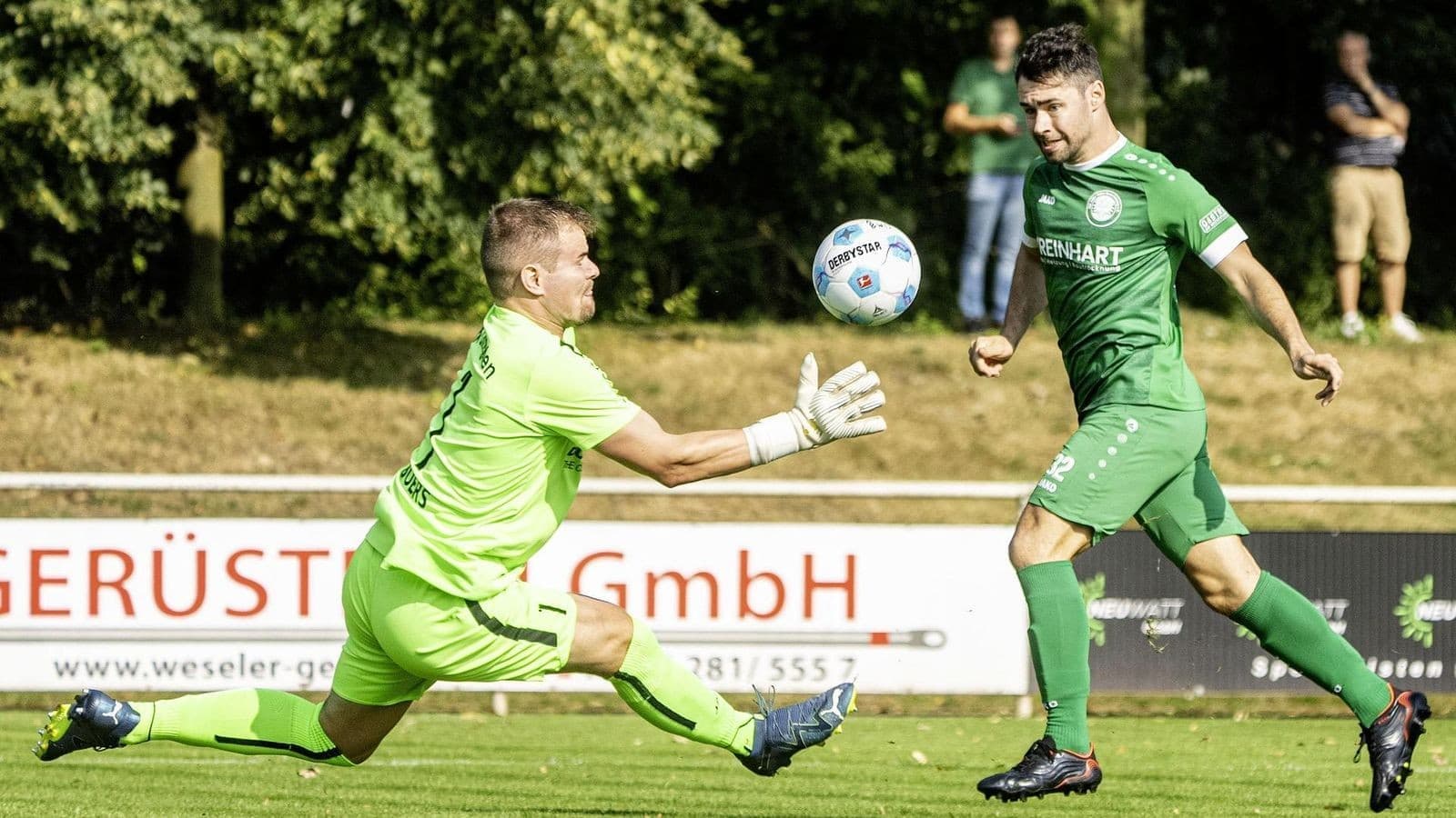 Goalkeeper saving a shot during football match Goalkeeper saving a shot during football match
