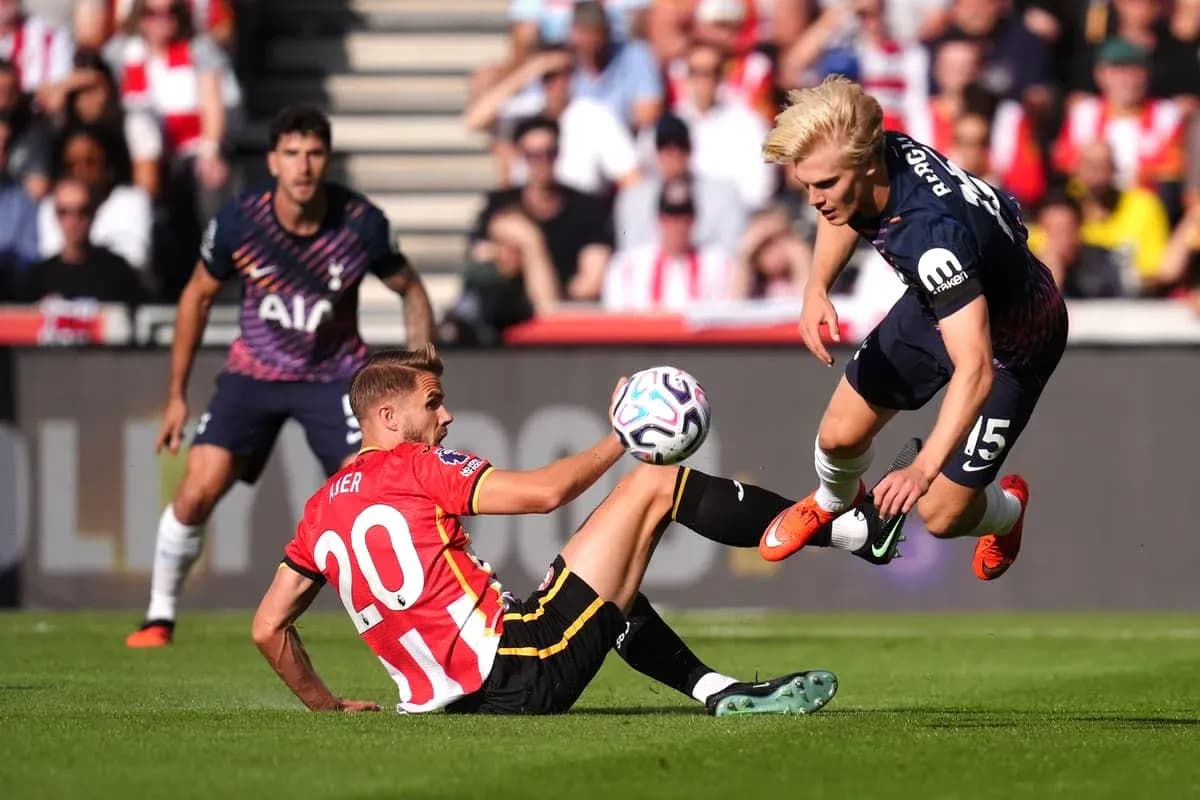 Player tackling opponent during football match action Player tackling opponent during football match action