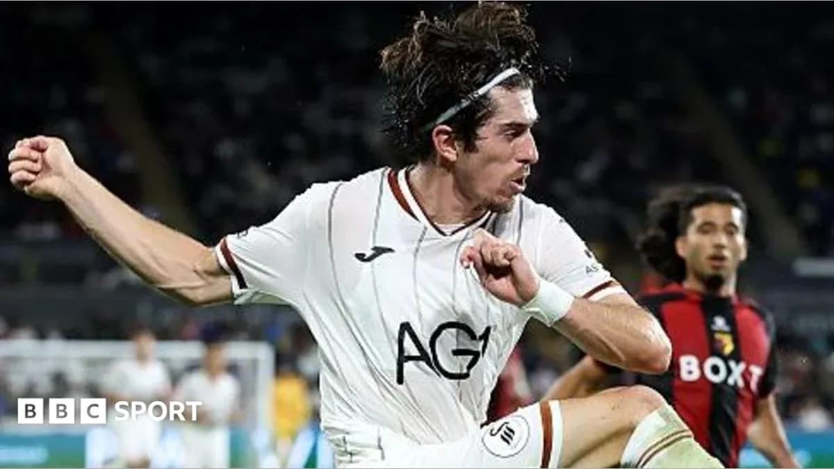 Player kicking ball during a football match Player kicking ball during a football match