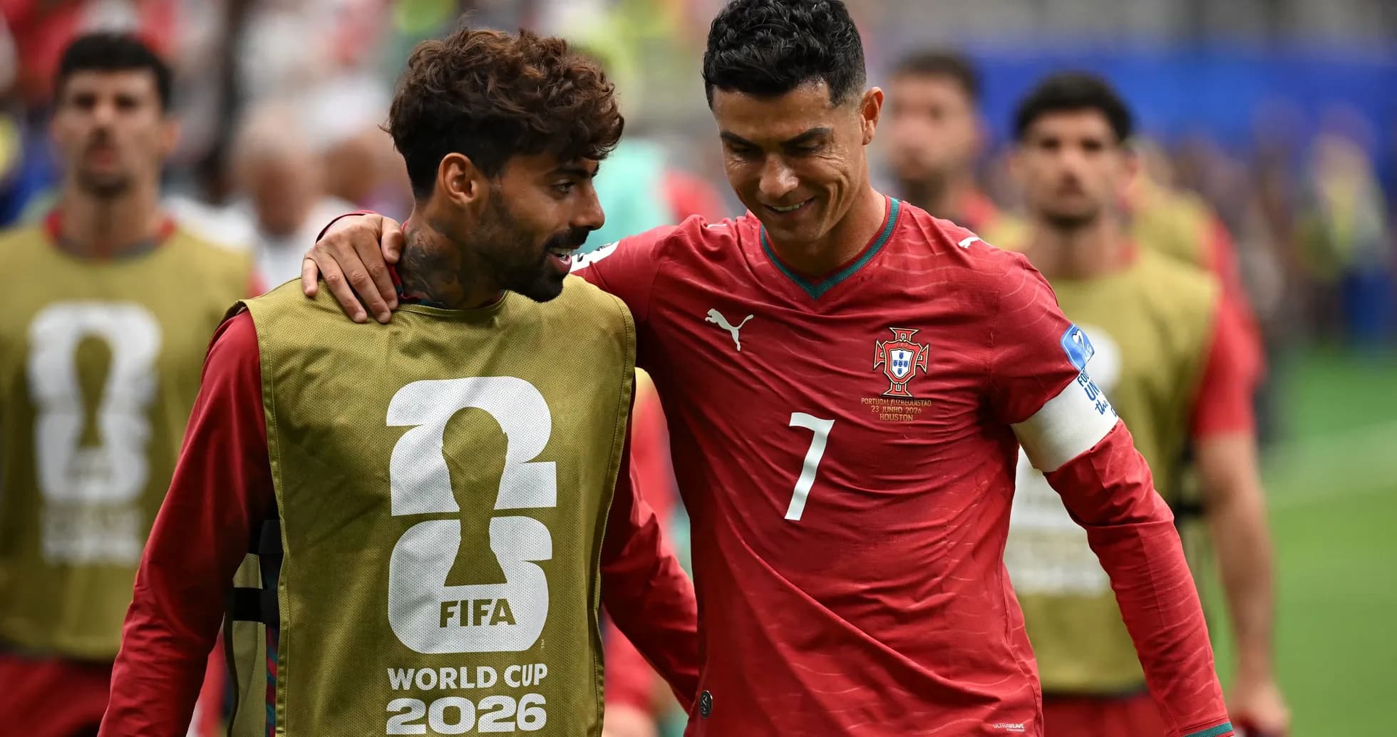 Two Portuguese players interacting on the field Two Portuguese players interacting on the field