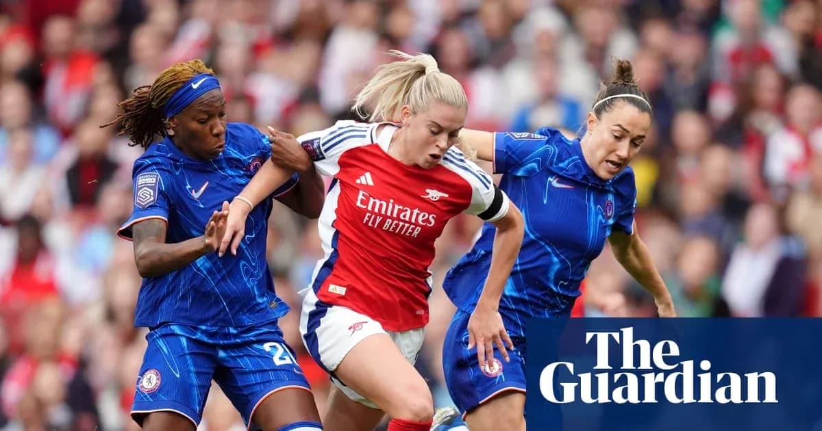 Two Chelsea players challenging Arsenal player for the ball Two Chelsea players challenging Arsenal player for the ball