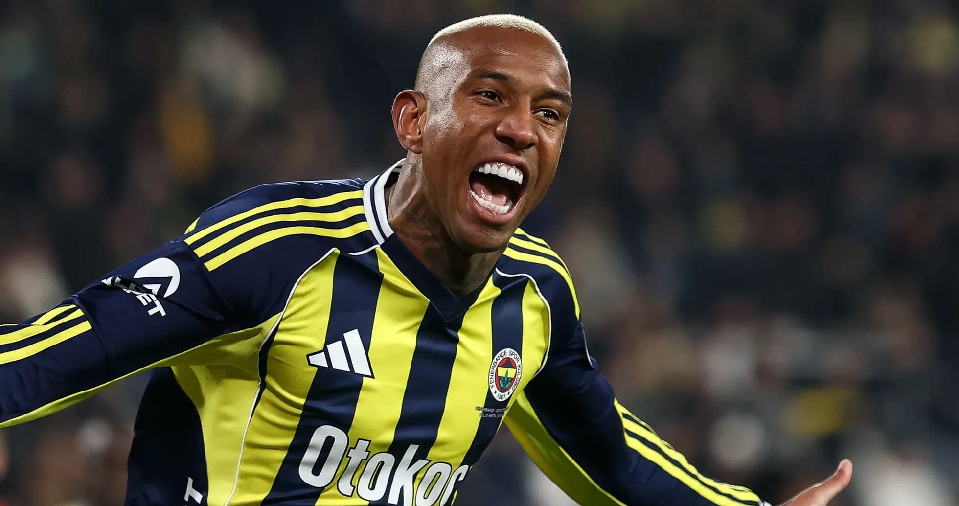 Player celebrating goal in Fenerbahçe jersey Player celebrating goal in Fenerbahçe jersey