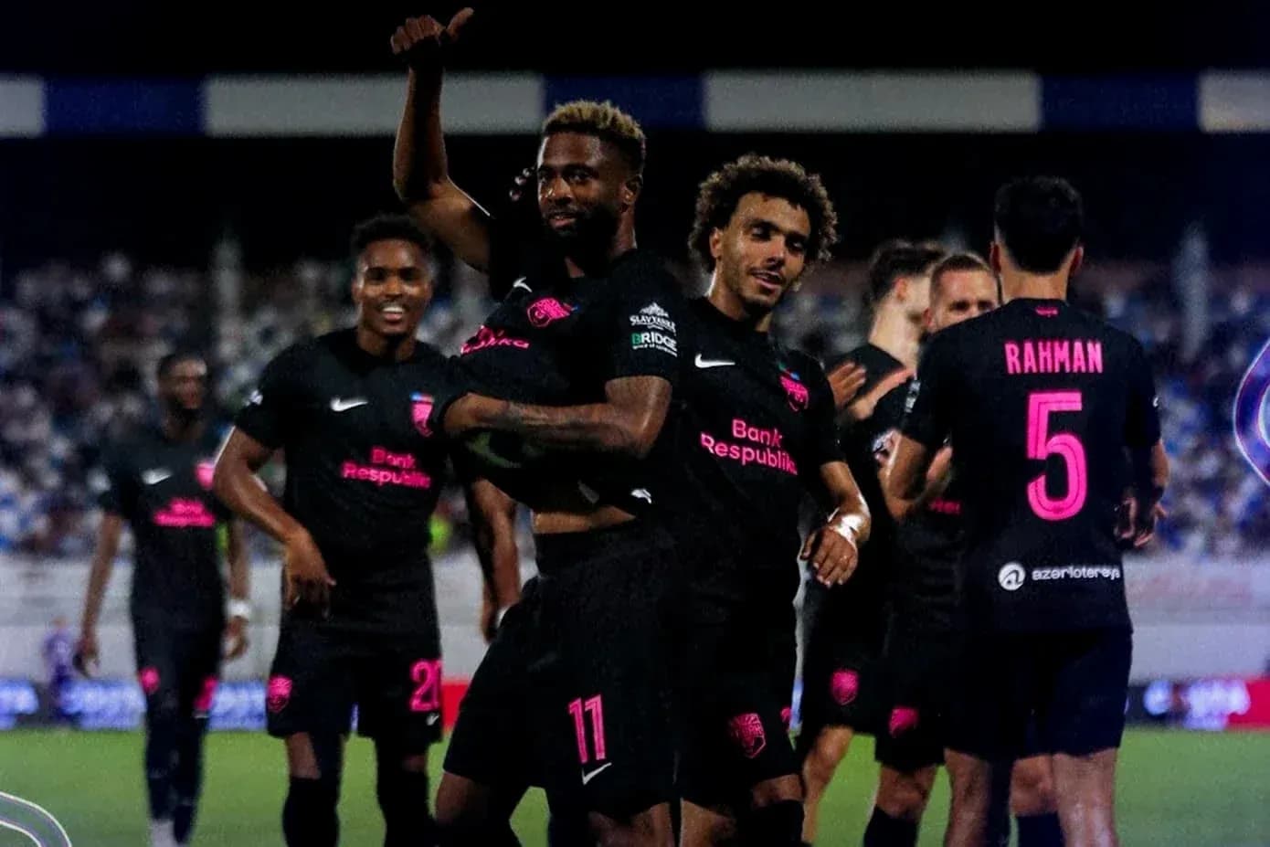 Players celebrating a goal during UEFA match Players celebrating a goal during UEFA match