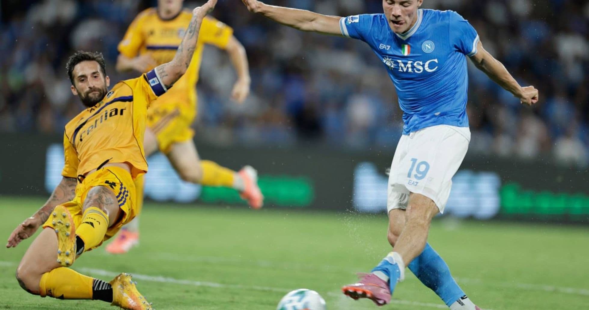 Napoli player dribbling past Pisa defender Napoli player dribbling past Pisa defender