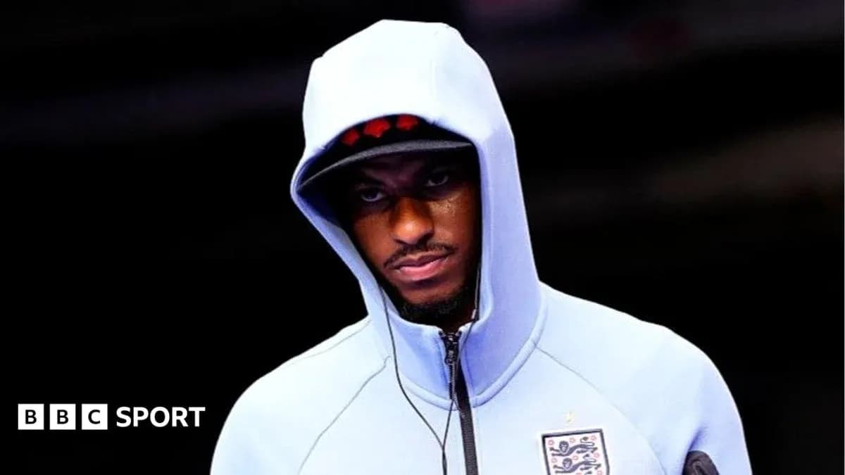 Player wearing a hooded sweatshirt before a match Player wearing a hooded sweatshirt before a match