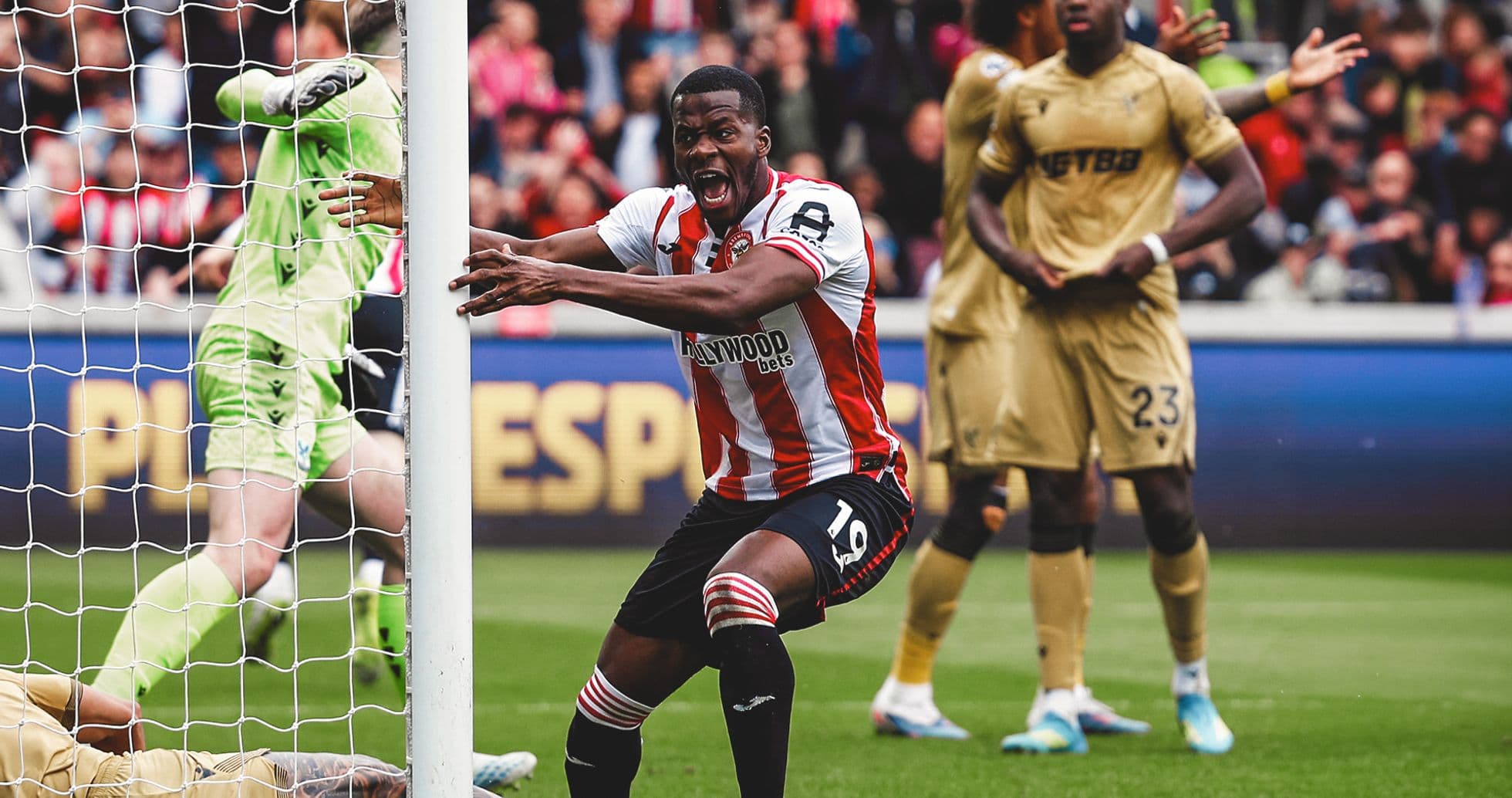 Brentford player celebrating after scoring a goal Brentford player celebrating after scoring a goal