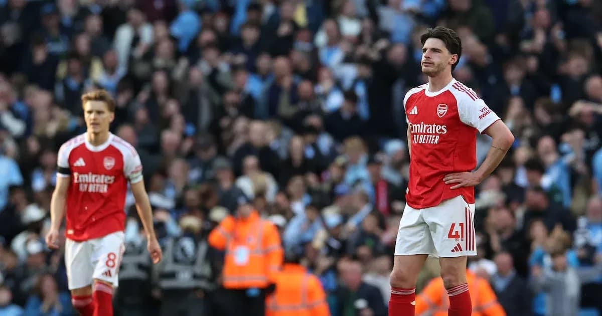 Arsenal players walking dejectedly after match Arsenal players walking dejectedly after match