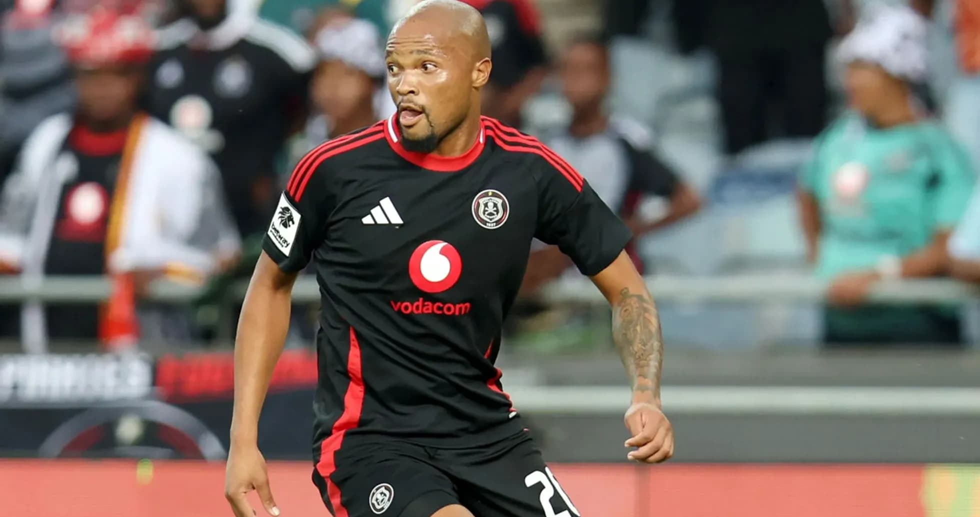 Player in black jersey running on the field Player in black jersey running on the field