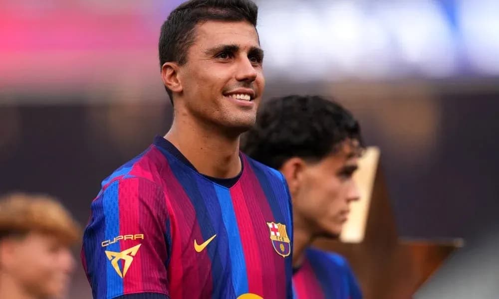 Player smiling in FC Barcelona kit during ceremony Player smiling in FC Barcelona kit during ceremony