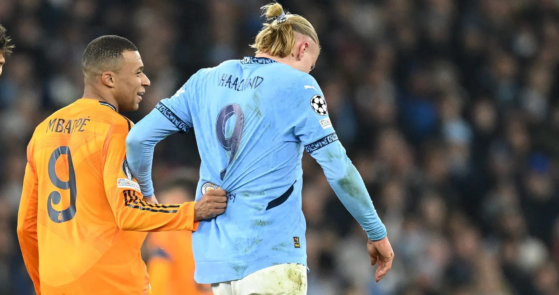 Kylian Mbappé pulling Erling Haaland's shirt during match Kylian Mbappé pulling Erling Haaland's shirt during match