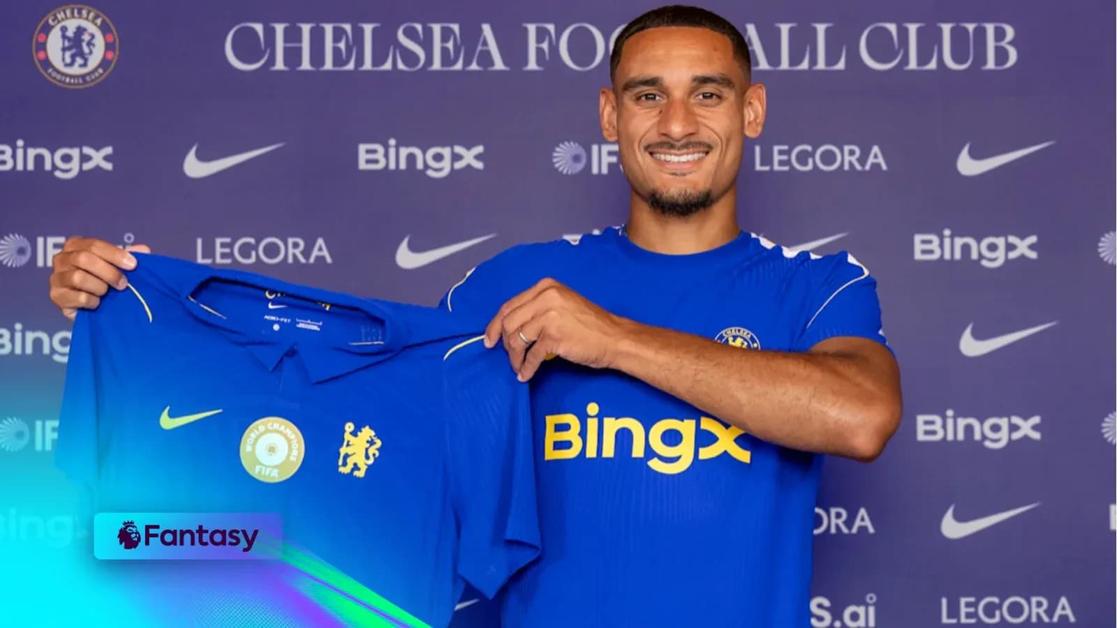 Player holding Chelsea FC jersey at presentation event Player holding Chelsea FC jersey at presentation event