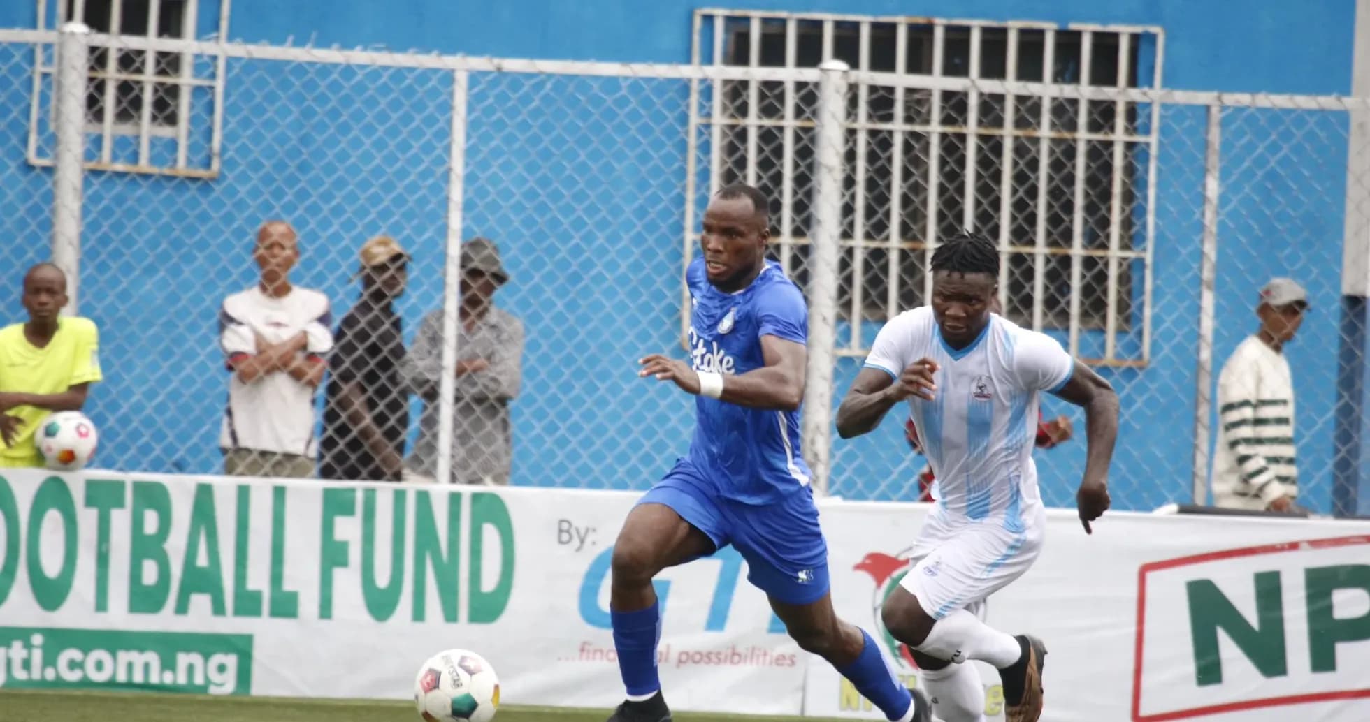 Players competing for the ball in NPFL match Players competing for the ball in NPFL match
