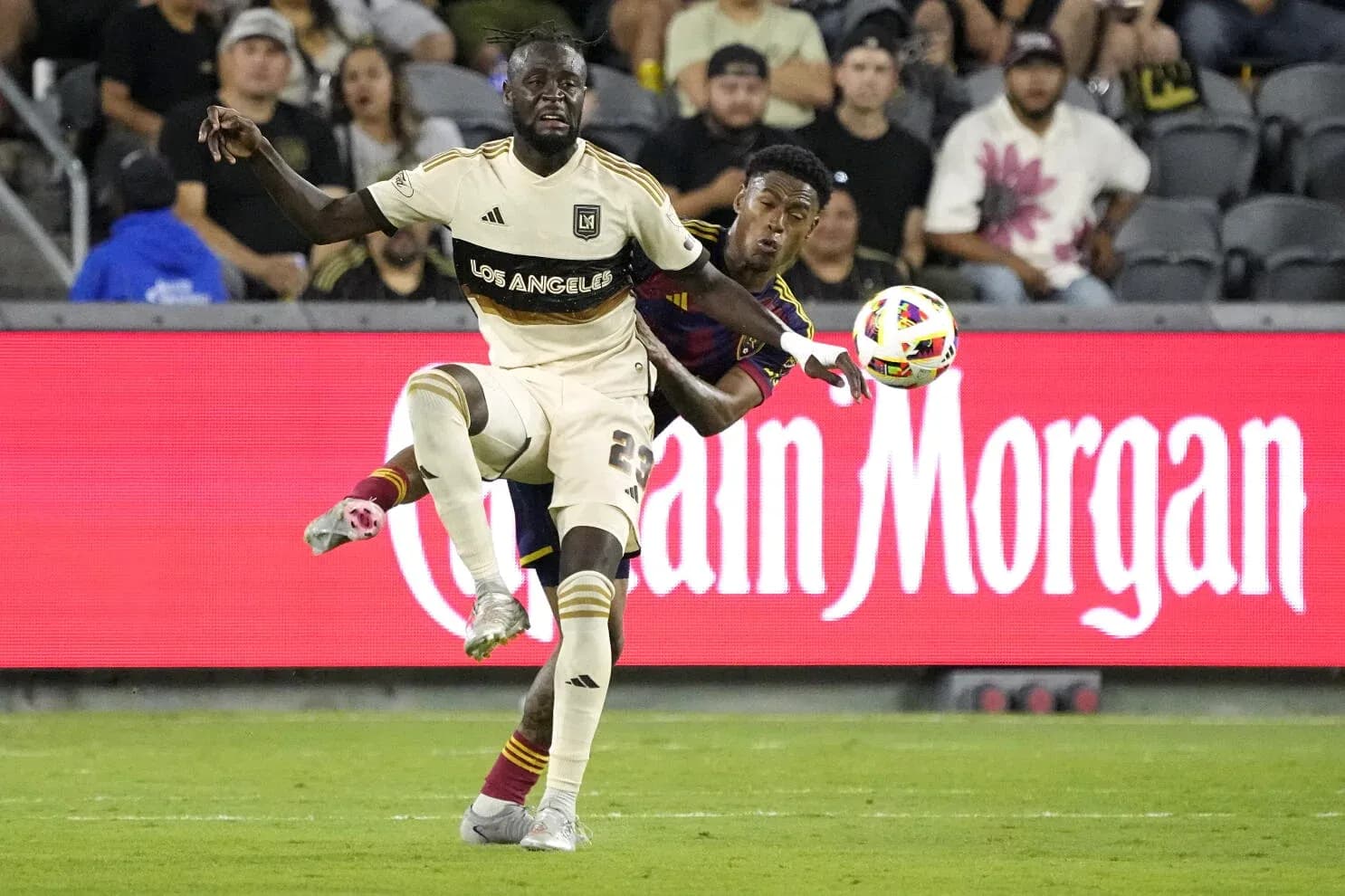 Players competing for the ball in MLS match Players competing for the ball in MLS match