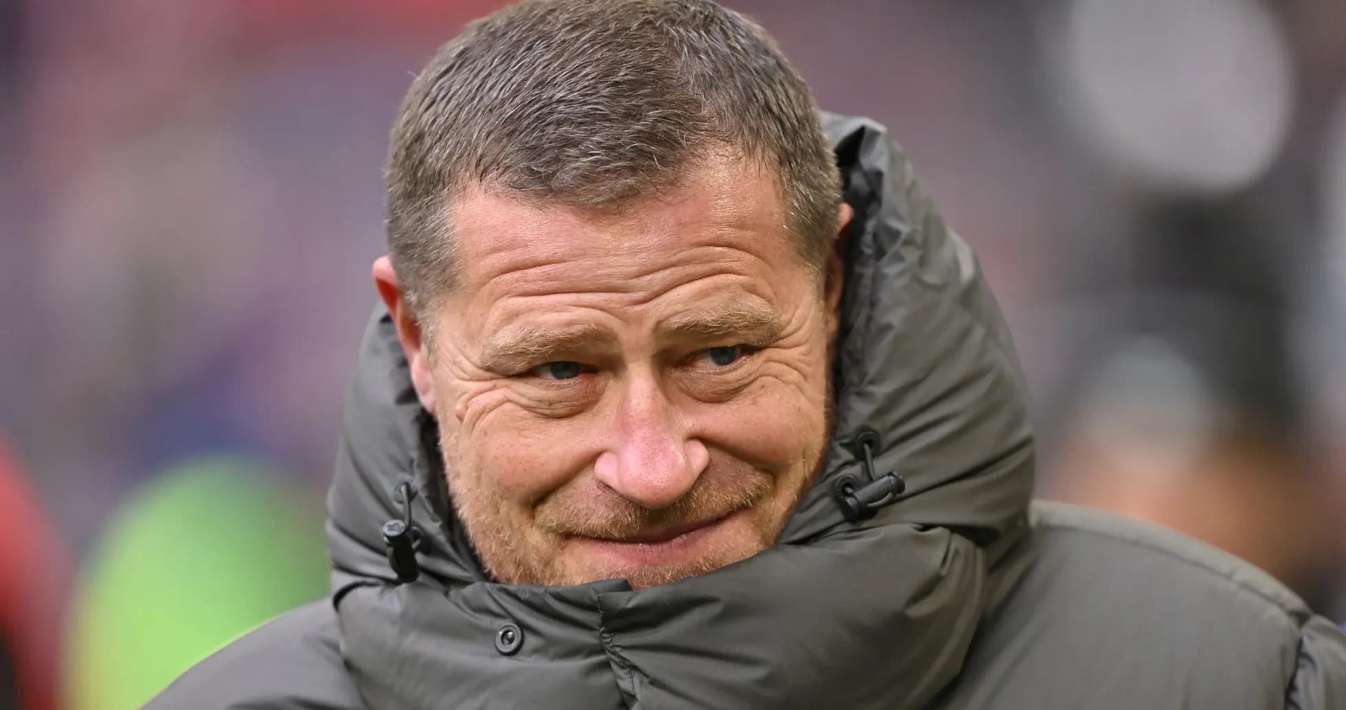 Coach wearing a puffy jacket on the sidelines Coach wearing a puffy jacket on the sidelines