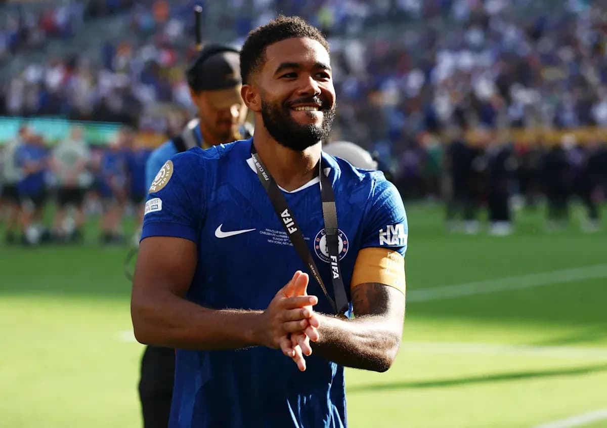 Player celebrating with medal after match victory Player celebrating with medal after match victory