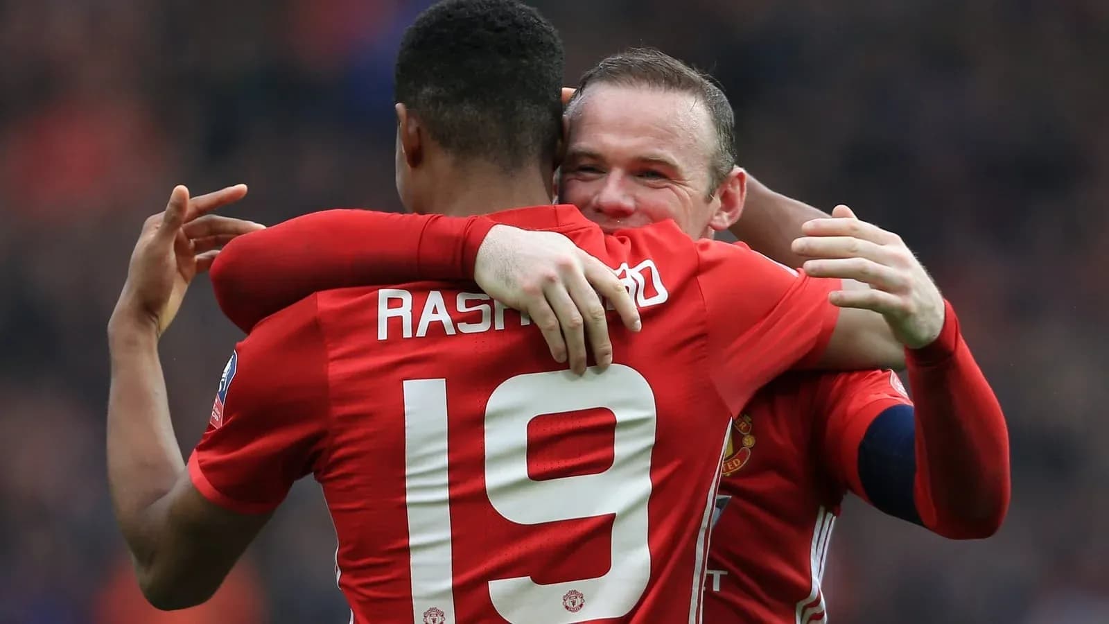 Two Manchester United players celebrating a goal Two Manchester United players celebrating a goal