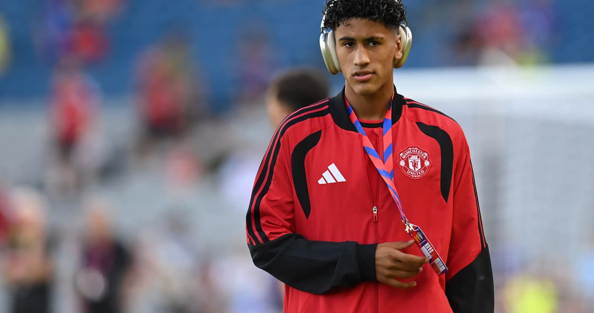 Player wearing headphones before match at stadium Player wearing headphones before match at stadium