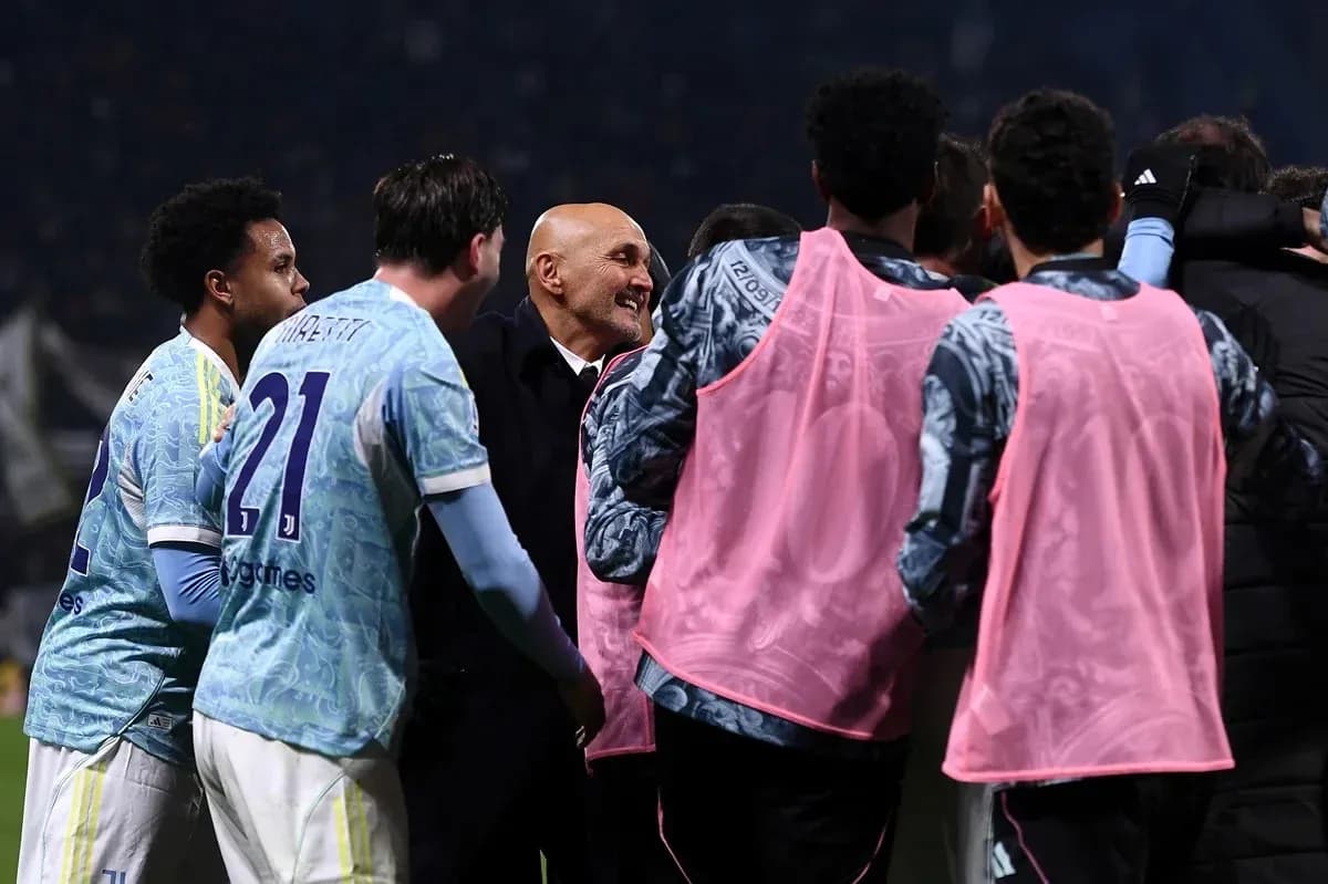 Players celebrating with coach after a match Players celebrating with coach after a match