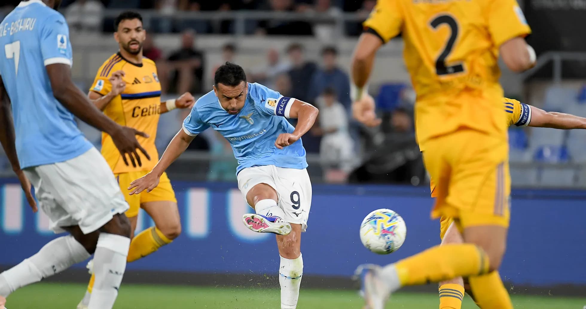 Lazio player taking a shot on goal Lazio player taking a shot on goal