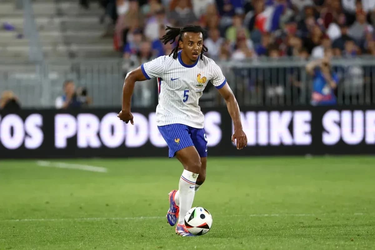 Player in France kit dribbling a soccer ball Player in France kit dribbling a soccer ball