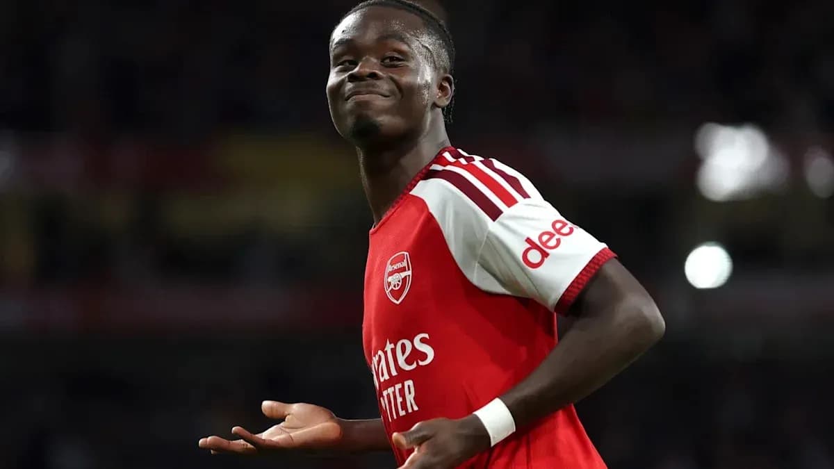 Player celebrating after scoring for Arsenal Player celebrating after scoring for Arsenal
