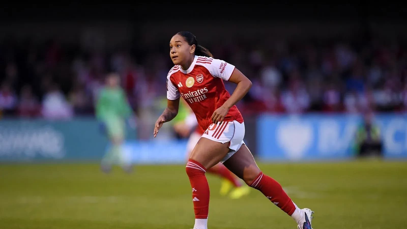 Player running on the pitch during a match Player running on the pitch during a match