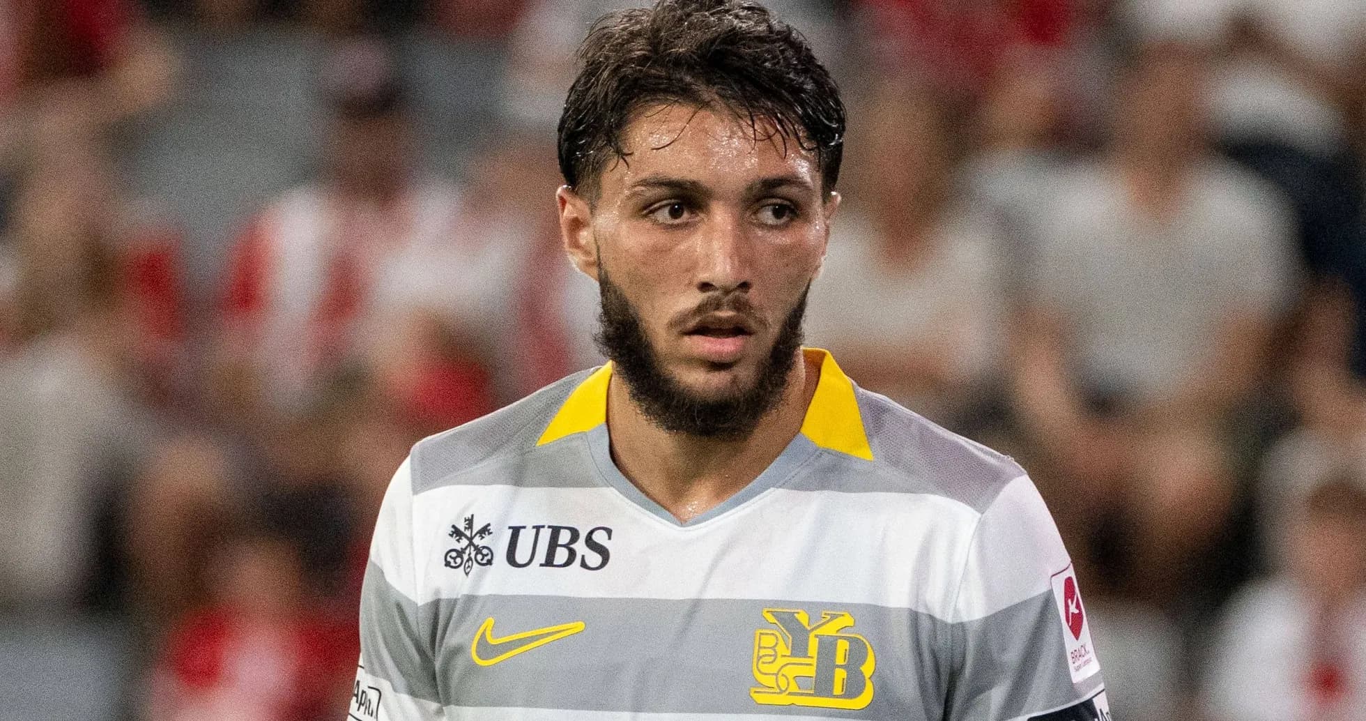 Player in gray and yellow jersey during match Player in gray and yellow jersey during match