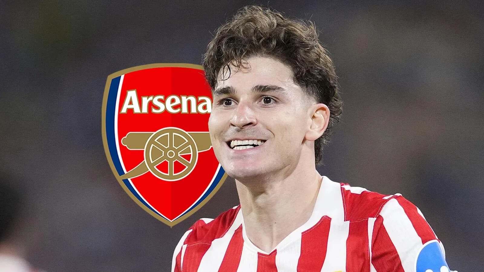 Player smiling with Arsenal logo in background Player smiling with Arsenal logo in background