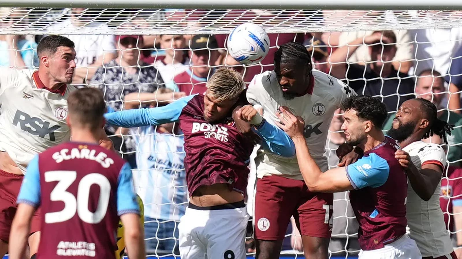 Players contesting a header near the goal Players contesting a header near the goal