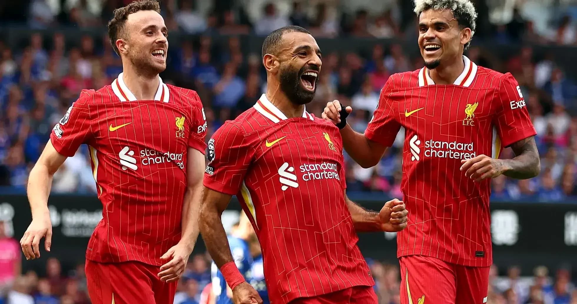Liverpool players celebrating a goal together Liverpool players celebrating a goal together