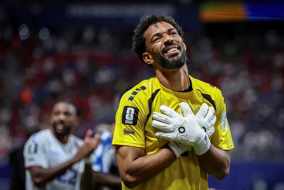 Goalkeeper celebrating with hands on chest after match Goalkeeper celebrating with hands on chest after match