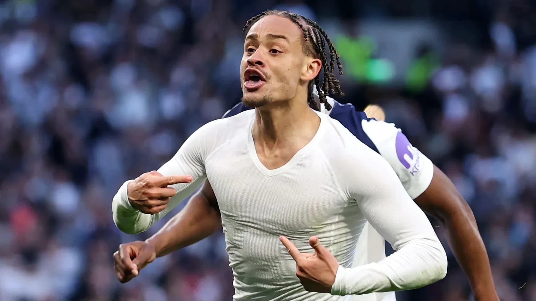 Player celebrating and pointing during a match Player celebrating and pointing during a match