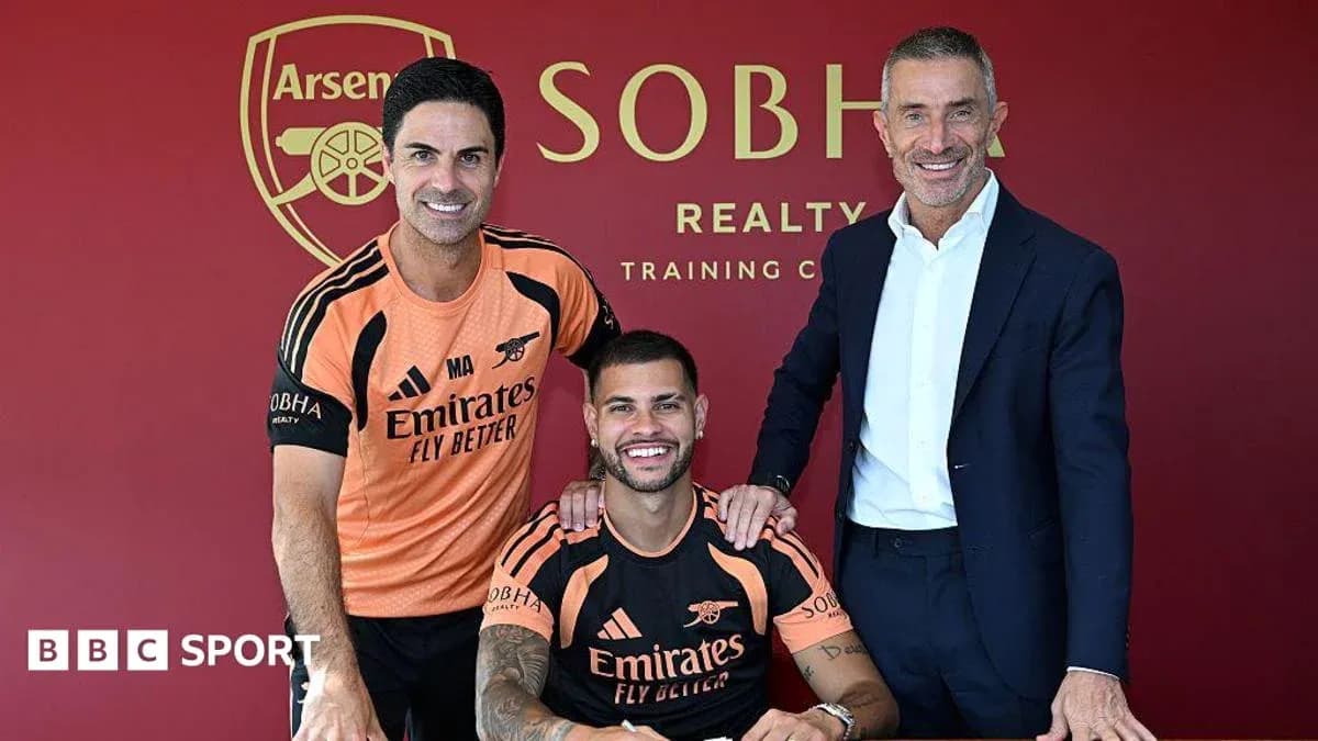 Manager and player signing contract at Arsenal training center Manager and player signing contract at Arsenal training center