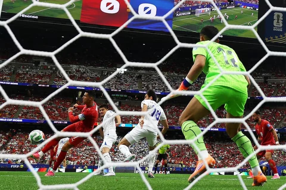 Goalkeeper preparing to save shot during match Goalkeeper preparing to save shot during match