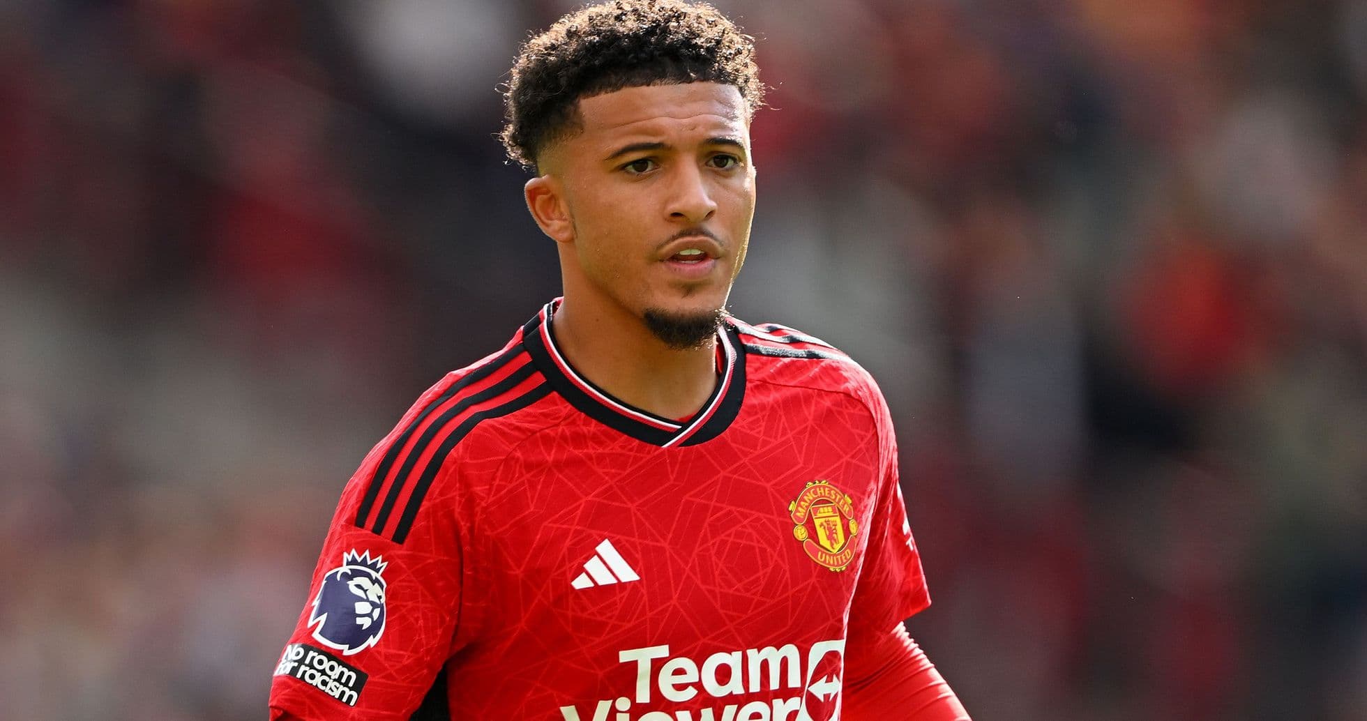 Player in Manchester United jersey on the field Player in Manchester United jersey on the field