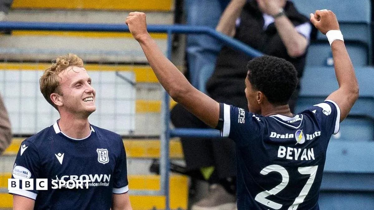 Two football players celebrating a goal together Two football players celebrating a goal together