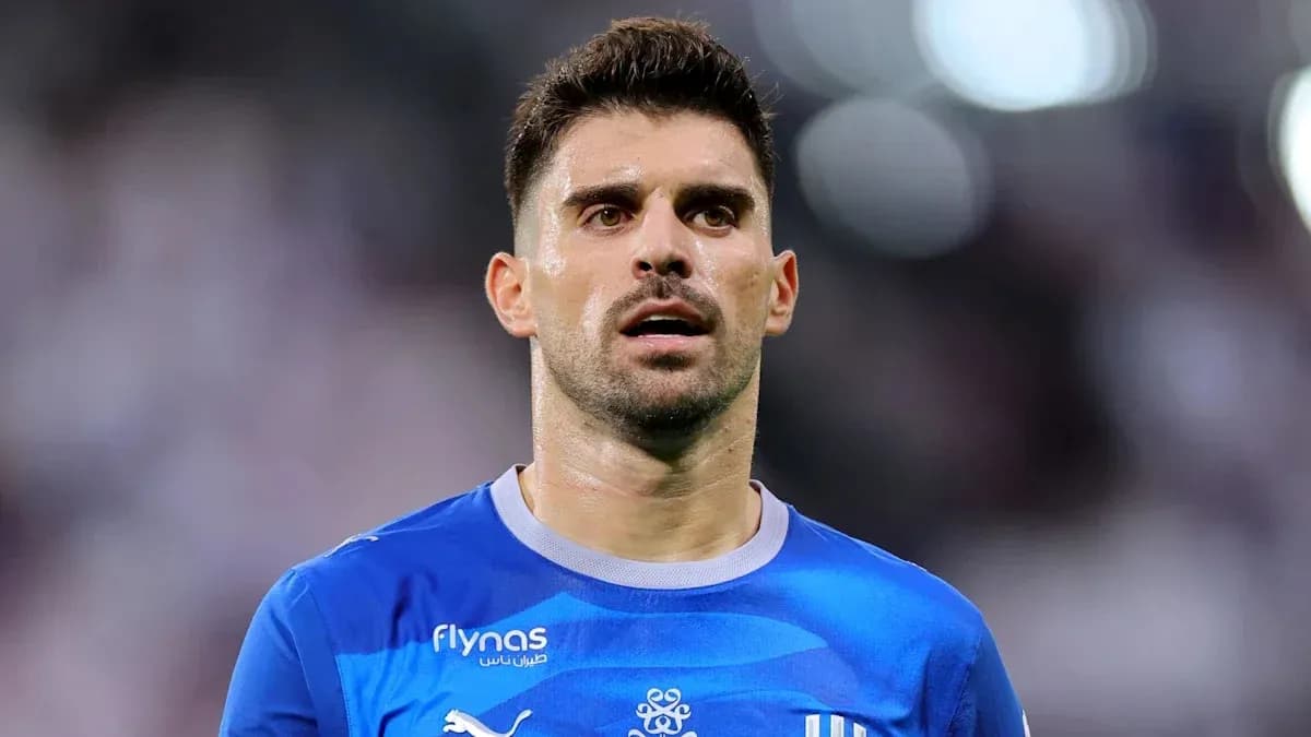 Football player in blue jersey during match Football player in blue jersey during match