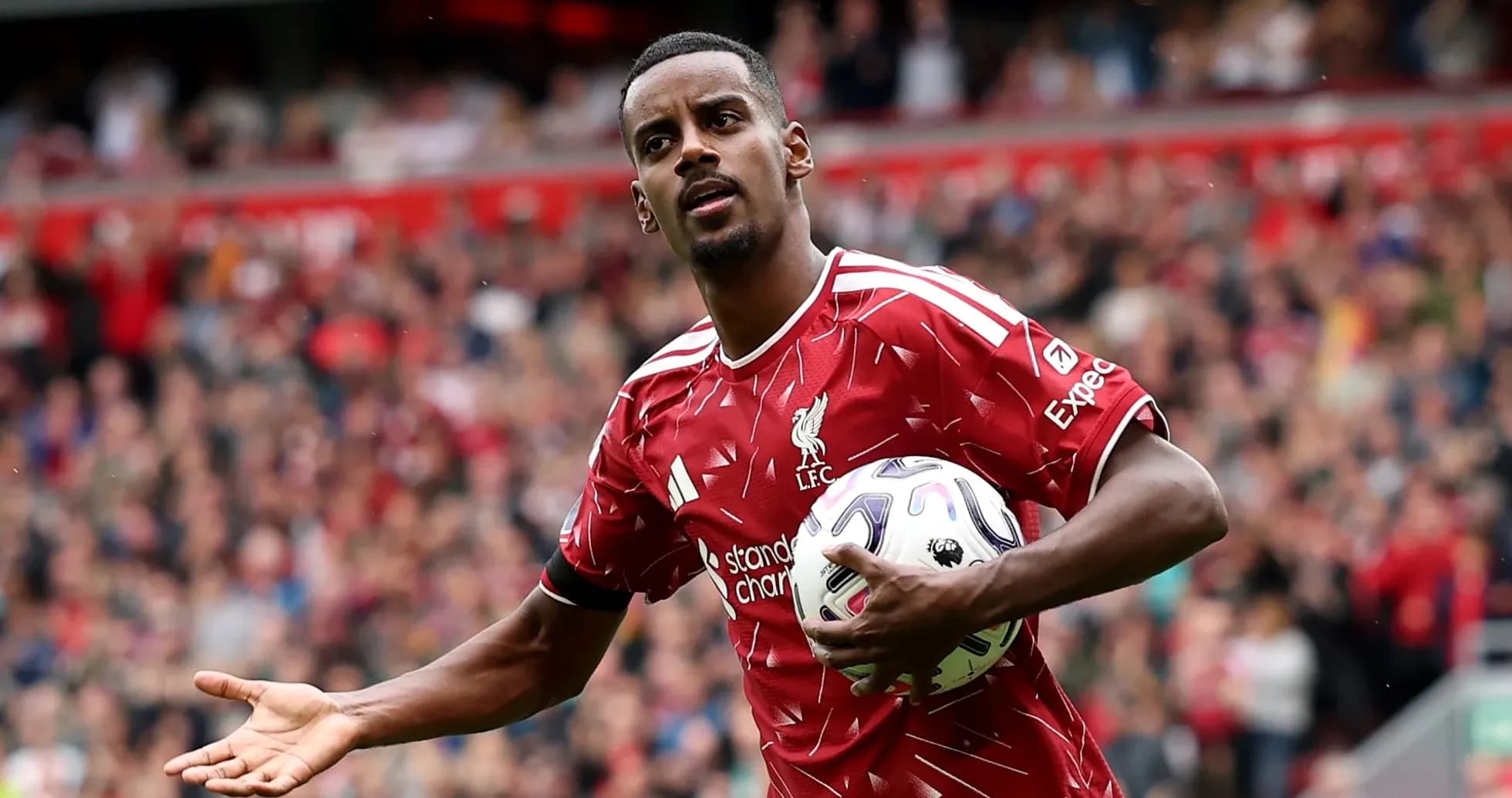 Player holding ball during match at Anfield Player holding ball during match at Anfield