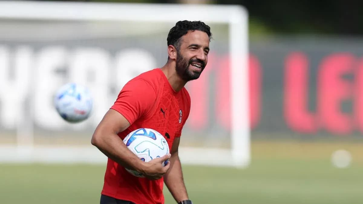 Player holding soccer balls during training session Player holding soccer balls during training session