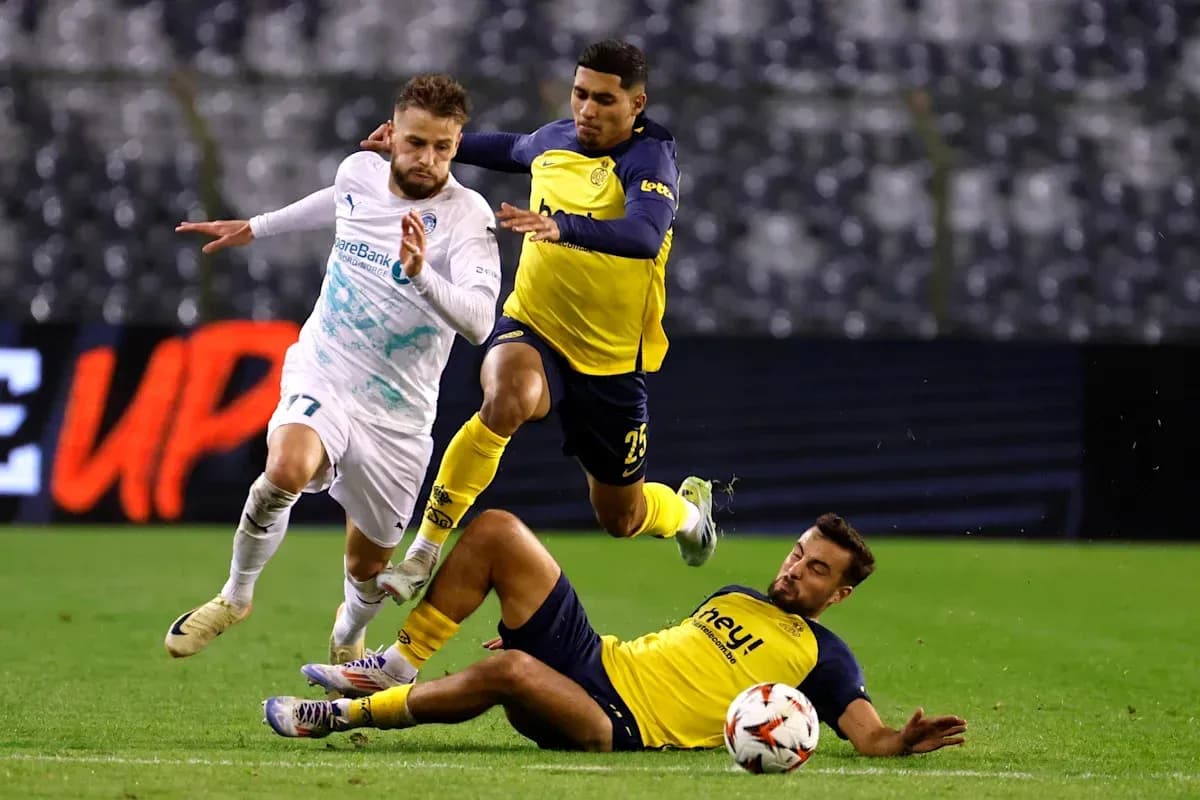 Player dribbling past opponents during a match Player dribbling past opponents during a match
