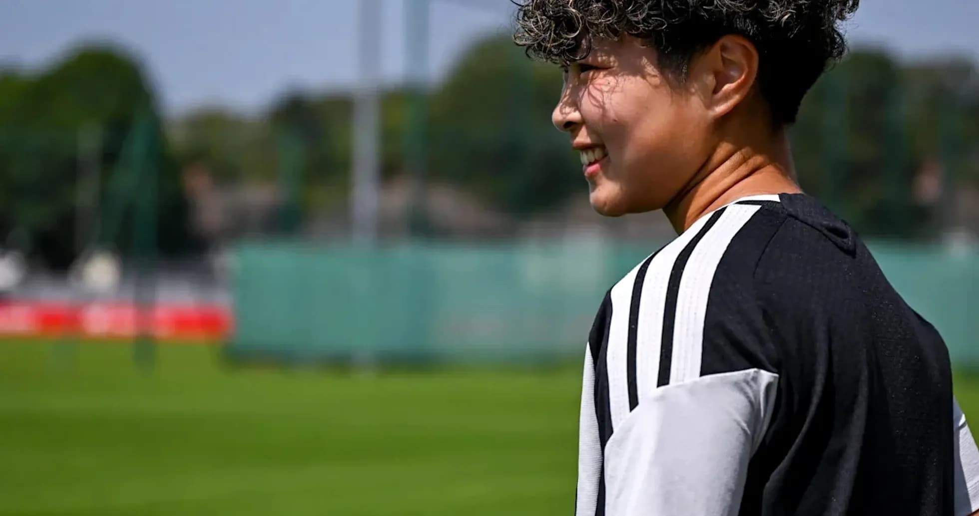 Player in training kit on football pitch Player in training kit on football pitch