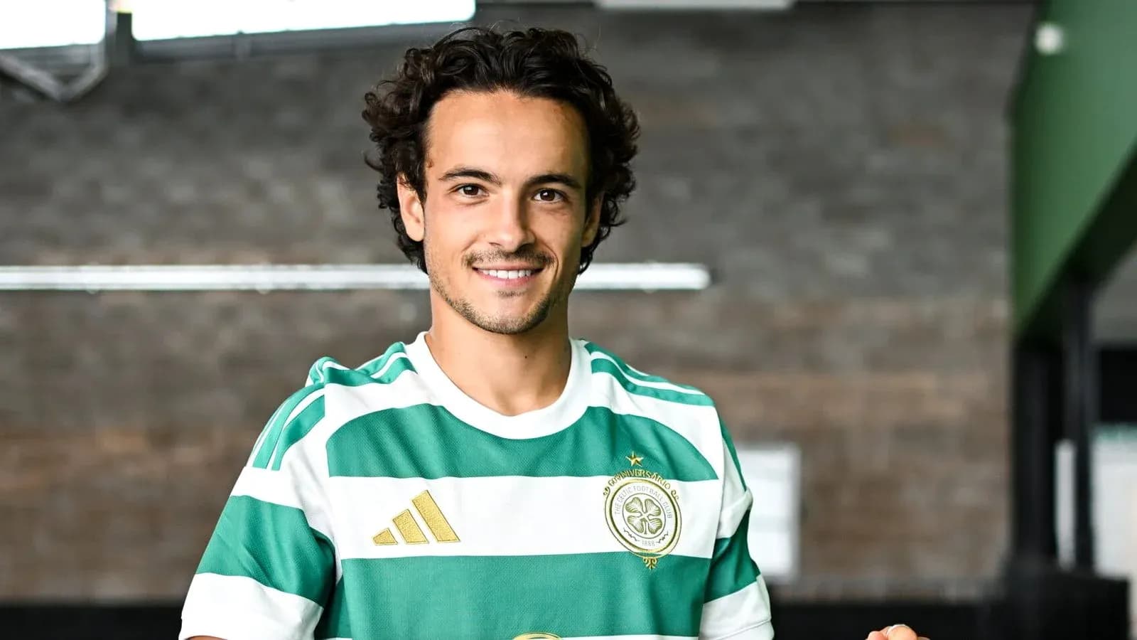 Player smiling in Celtic FC home kit Player smiling in Celtic FC home kit